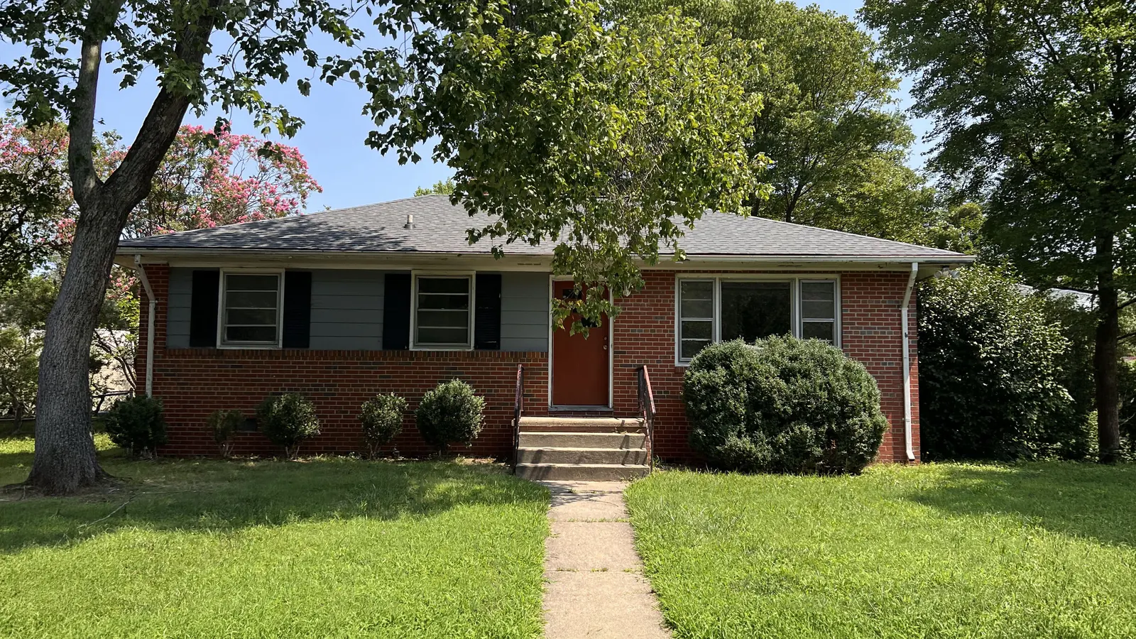 Front of a house with a lawn