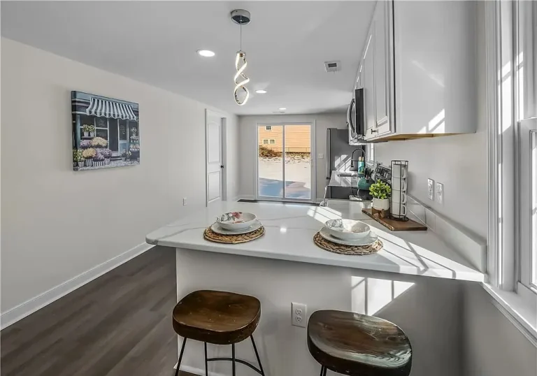 Renovated kitchen with white cabinets